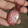 Rhodochrosite pendant with sunstone beads